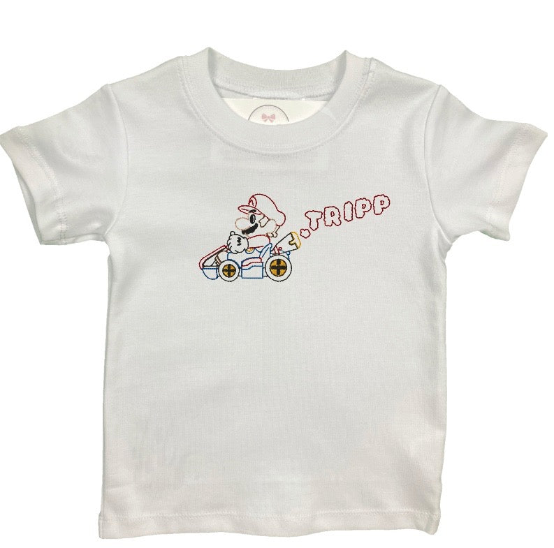 White t-shirt with a graphic design of a character in a racing car and text on a white background